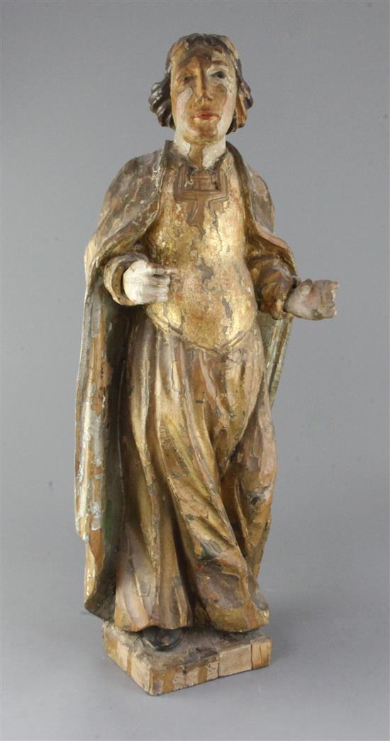 An 18th century Continental carved and painted limewood figure of a saint, H.24in.